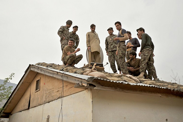 Afghan soldiers watch a cricket match, April 15. Manjunath Kiran—AFP