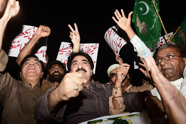 Musharraf supporters protest in Lahore, April 18. Arif Ali—AFP
