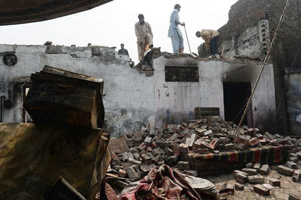 Razed Christian homes in the Joseph Colony area of Lahore. Arif Ali—AFP 