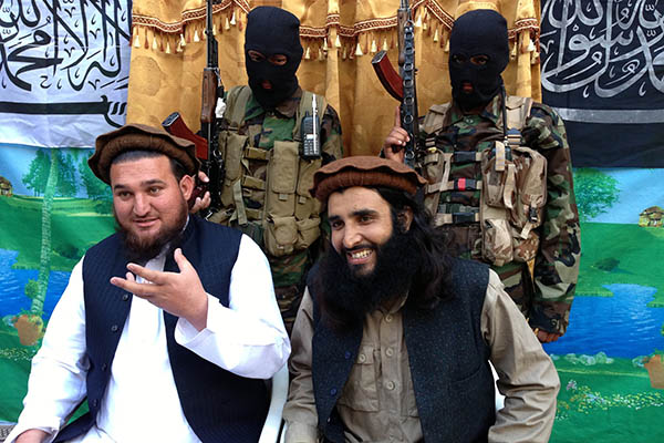 Adnan Rasheed (right) with former TTP spokesman Ihsanullah Ihsan. Haji Muslim—AFP