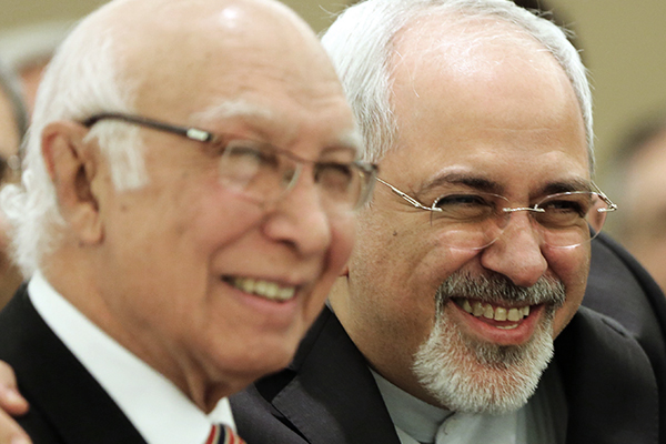 Aziz and Zarif in Tehran, Nov. 26. Atta Kenare—AFP