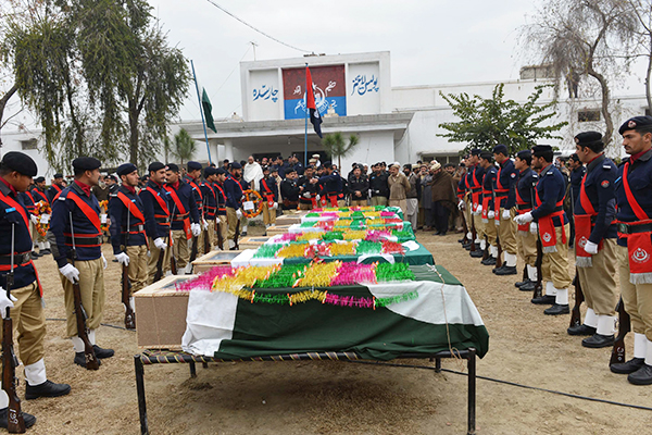 Funeral for policemen killed last month in Charsadda. A. Majeed—AFP