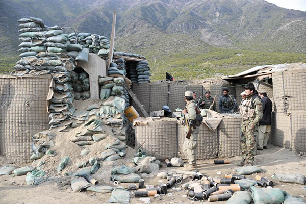 Afghan soldiers at the checkpoint destroyed during clashes with the Taliban. Noorullah Shirzada—AFP