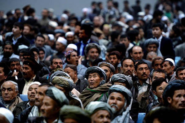 Afghans fill a local hall in Kabul to listen to presidential candidates. Wakil Kohsar—AFP