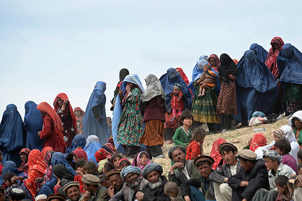 Survivors wait for aid in Badakhshan province. Farshad Usyan—AFP
