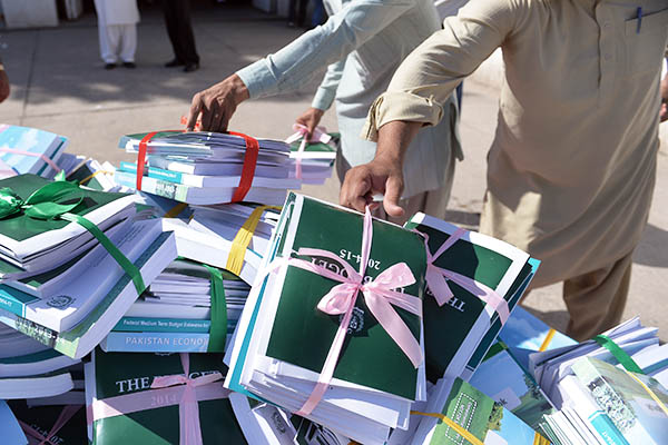 Copies of the federal budget arrive at the National Assembly. Aamir Qureshi—AFP