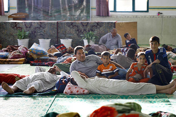 Refugees of the Islamic State’s self-imposed sharia rest at a local shelter. Haidar Hamdani—AFP