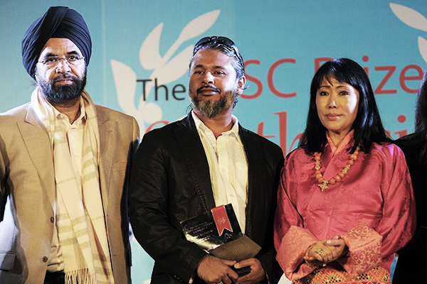 Karunatilaka (center) won the 2012 DSC Prize. Prakash Singh—AFP
