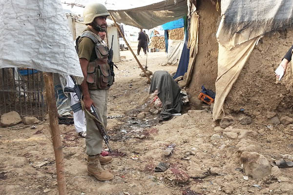 Security officials at the site of the bombing in Hangu. Basit Shah—AFP
