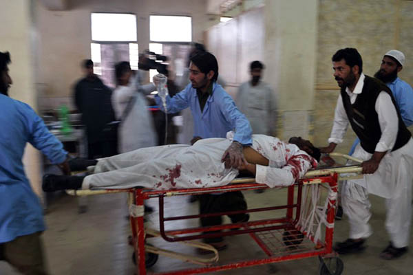 Paramedics rush to hospital one of the victims of Thursday’s blast. Banaras Khan—AFP