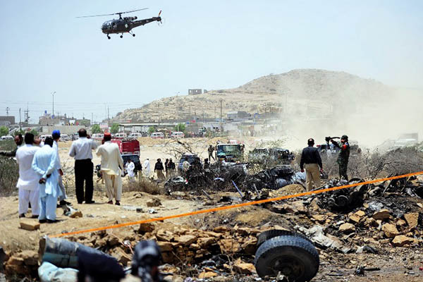 Wreckage at the site of an Air Force crash near Karachi, June 2014. Asif Hassan—AFP