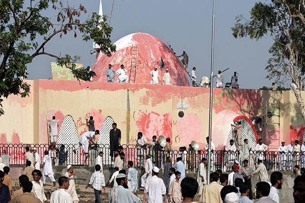 Retaking, and repainting, the Lal Masjid in Islamabad, July 27, 2007. Aamir Qureshi—AFP