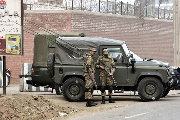 Soldiers stand guard outside the prison where the executions took place. Chaudhry Asad—AFP