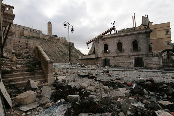 Damaged buildings outside the wall of Aleppo’s UNESCO-listed citadel. Zein al-Rifai-AMC—AFP
