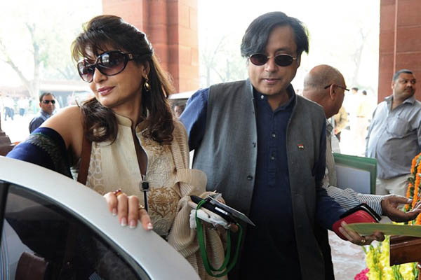 Shashi Tharoor with his wife Sunanda Pushkar in March 2012. Prakash Singh—AFP