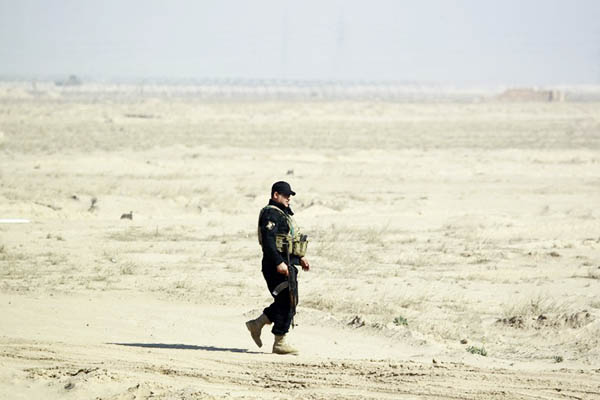 An Iraqi soldier on patrol near Anbar province. Haidar Hamdani—AFP