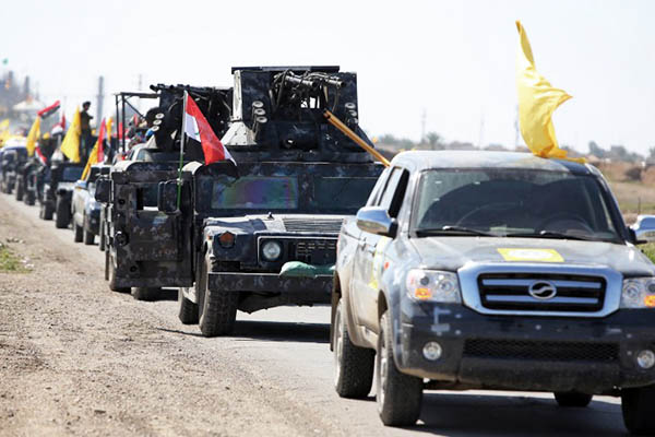 Iraqi fighters en route to fight I.S. forces in Tikrit. Ahmad al-Rubaye—AFP