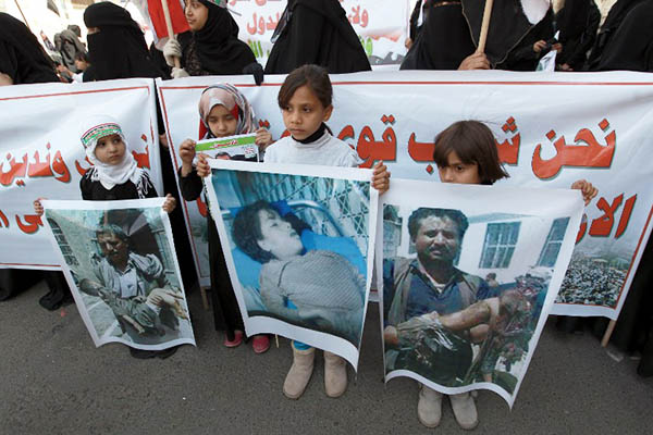 Yemeni children protest against the Saudi-led airstrikes targeting Houthi rebels. Mohammed Huwais—AFP