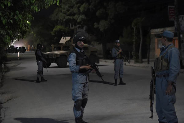 Afghan police outside the Park Palace guesthouse. Shah Marai—AFP