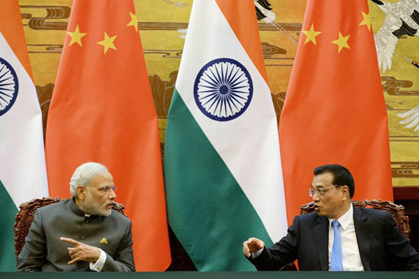 Indian premier Narendra Modi with Chinese premier Li Keqiang. Kenzaburo Fukuhara—AFP