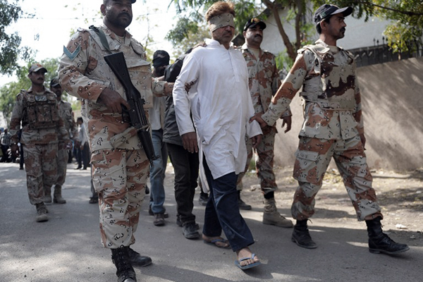 Rangers escort MQM activists to an antiterrorism court, Karachi, March 12. Rizwan Tabassum—AFP
