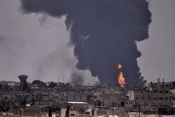 Smoke billows in the Syrian city of Hasakeh on June 28 following a mortar attack by I.S. Delil Souleiman—AFP