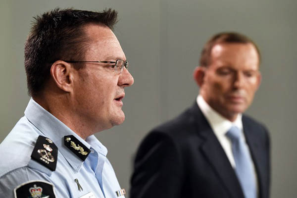 An Australian official announces arresting the two men who planned to target the Anzac Day parade. William West—AFP