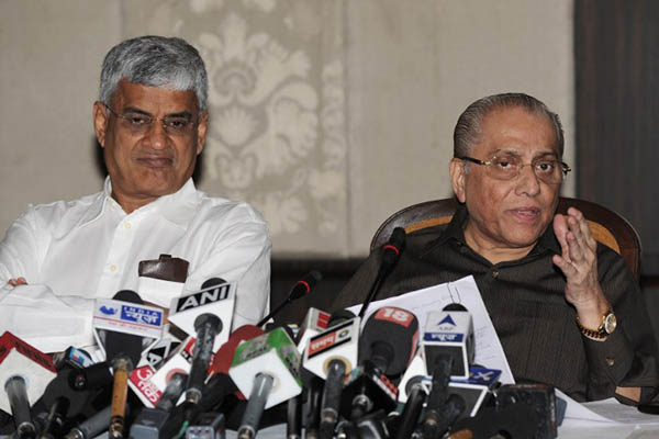 Board of Control for Cricket in India President Jagmohan Dalmiya (right) addresses a press conference with BCCI secretary Sanjay Patel on June 10, 2013. Sajjad Hussain—AFP