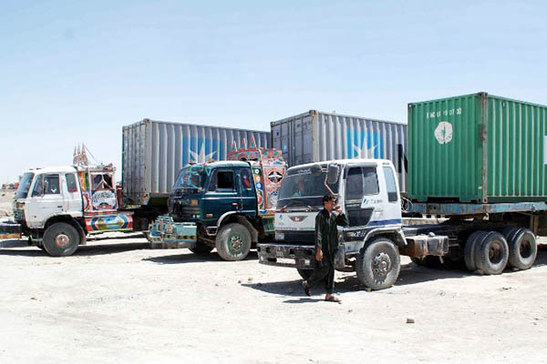 Shipping containers are the most popular—and cheapest—option for cross-border travel. Asghar Achakzai—AFP
