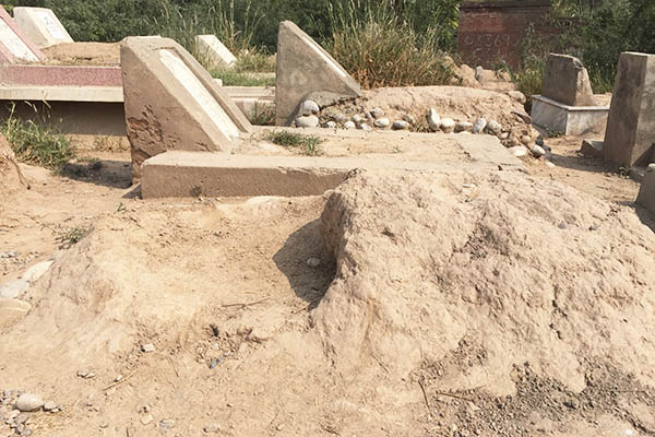 The remains of one of two unmarked militant graves in a Peshawar cemetery.