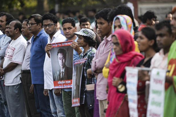 Activists protest against Nazimuddin Samad’s murder. Munir uz Zaman—AFP