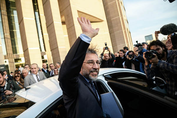Can Dundar, editor-in-chief of Cumhuriyet, leaves court after the hearing. Ozan Kose—AFP