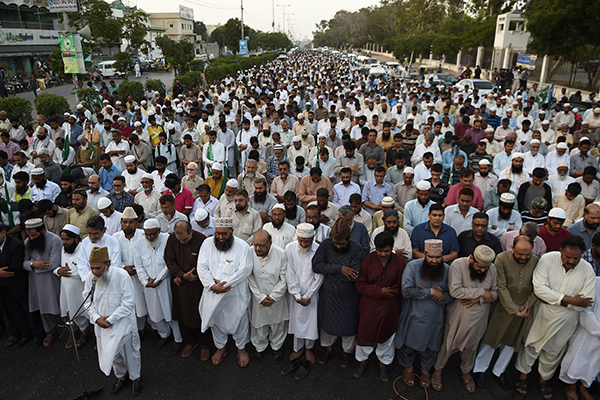 Jamaat supporters in Karachi offer prayers for Bangladesh’s hanged Nizami, May 11. Asif Hassan—AFP