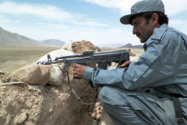 A policeman at a checkpoint on the Kandahar-Tarin Kot highway. Rateb Noori—AFP