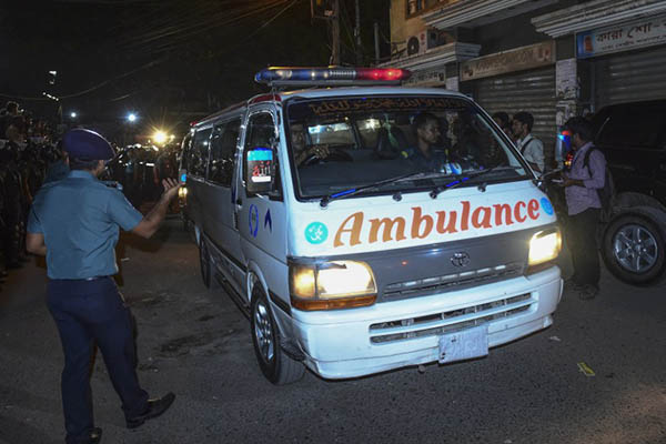 An ambulance carrying the body of Motiur Rahman Nizami leaves prison. AFP