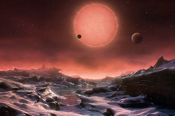 An artist’s impression of the view from the surface of one of the three planets.