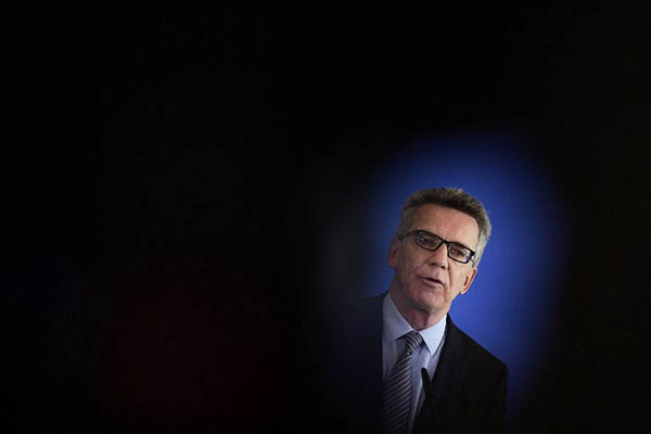 German Interior Minister Thomas de Maiziere gives a press conference on the attack. Tobias Schwarz—AFP