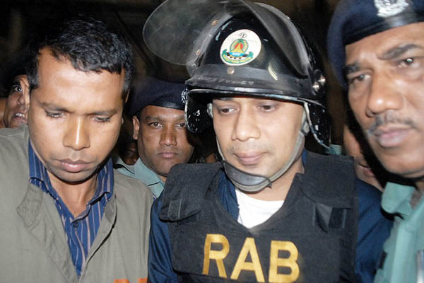 Police escort Rahman (center) to court in 2007. Farjana K. Godhuly—AFP